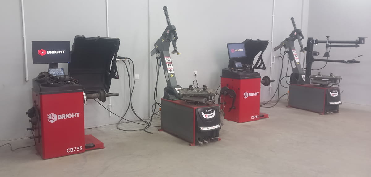 a photo of several machines for working with tires